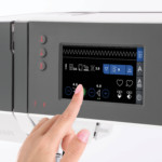 photo of touch screen on quilt ambition 630 with hand