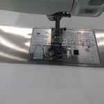 Sewing area showing clean needle plate